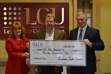 LCU Presents Habitat for Humanity with Shred-A-Thon Proceeds